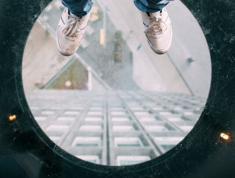 Person standing on a viewing platform - Cookiebot